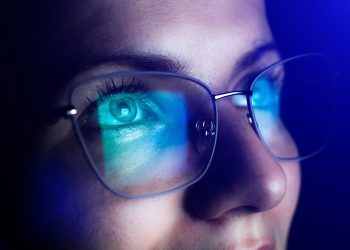 Girl,Works,On,Internet.,Reflection,At,The,Glasses,From,Laptop.